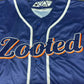 Blue sports jersey with 'Zooted' branding on a dark background